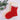 Red and beige crocheted Christmas stocking with white lace trim on a light background.